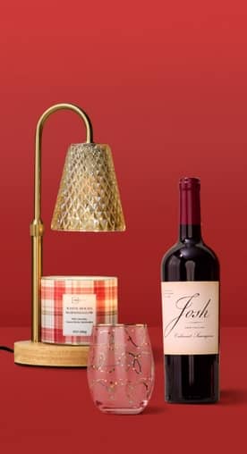 A candle warmer, wine glass and Josh bottle of wine is shown.